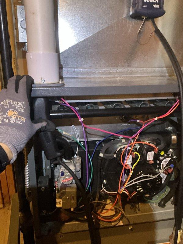 Responded to no heat call on heat pump system with thermostat set to 67°F but reading 63°F. Accessed furnace cabinet and inspected internal components including blower motor assembly, wiring connections, and heat exchanger. Performed combustion analysis testing using digital analyzer, which revealed readings of 182% efficiency and 55 ppm CO levels. Verified proper operation of heating system and restored unit to normal heating function.
