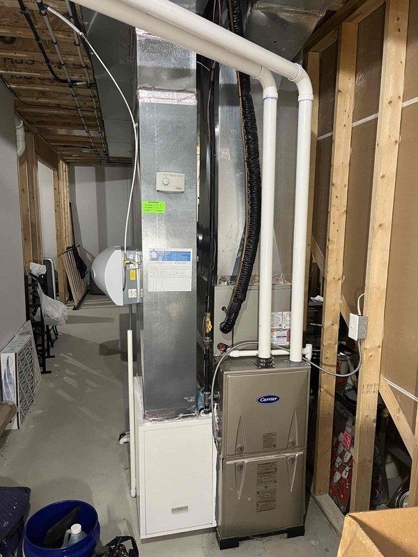 Completed annual cooling maintenance on Carrier HVAC system as part of 3-year recurring service agreement. Performed comprehensive inspection of air handler and condenser unit, checking refrigerant levels, electrical connections, and overall system operation. Verified proper function of Aprilaire humidifier integration with the system. Cleaned and inspected all accessible components, tested thermostat operation, and confirmed adequate airflow throughout the ductwork. System operating within manufacturer specifications with no issues identified. Documentation photos captured for service records.