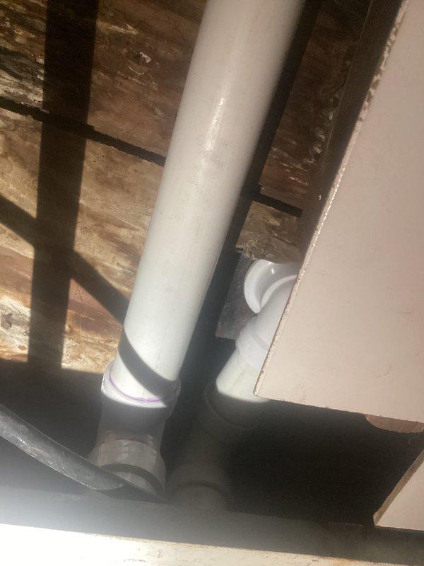 Rebuilt tub drain assembly and replaced complete waste and overflow system. Installed new PVC drain piping through floor joists with proper fittings and connections to ensure code-compliant drainage. All components tested and verified operational upon completion.