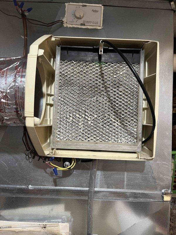 Completed annual heating and cooling tune-up on 2011 HVAC system with furnace, air conditioning, and humidifier components. Performed comprehensive inspection of air handler unit, including examination of heat exchanger for condensation and proper operation, verified all electrical connections and control board functionality, and inspected gas line connections and safety controls. Checked blower motor assembly, capacitor, and associated wiring for proper operation. Evaluated air filtration system and confirmed proper airflow through mesh filter assembly. Inspected humidifier unit and associated water connections, including PVC piping and shut-off valve. All components found operating within normal parameters with no immediate service needs identified. System covered under extended warranty through August 2032.