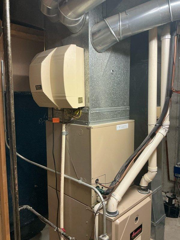 Conducted comprehensive assessment of 16-year-old HVAC system experiencing inefficient cooling performance with AC unit running continuously. Evaluated existing furnace, air conditioning unit, humidifier, and ductwork configuration in mechanical room to provide complete system replacement estimate. Documented current equipment specifications, installation layout, and existing infrastructure including condensate drainage, electrical connections, and ventilation components to determine optimal replacement solutions for improved energy efficiency and comfort control.
