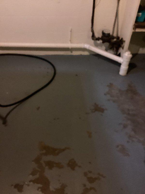 Responded to basement drain backup following severe storm event. Upon arrival, found significant water infiltration and staining on concrete basement floor with evidence of recent flooding. Inspected drainage system and plumbing infrastructure to identify source of backup. Assessed floor drain capacity and determined contributing factors to water intrusion. Documented existing water damage patterns and evaluated basement drainage configuration. Provided recommendations for preventing future backup incidents and discussed drainage solution options with property owner to address storm-related flooding concerns.