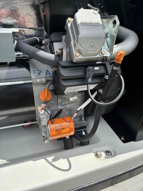 Completed routine generator tune-up and maintenance on Generac standby unit. Performed comprehensive inspection of all mechanical and electrical components, including battery condition, fuel connections, control panel operation, and hose fittings. Verified proper mounting hardware, checked all connection points with orange protective caps, and ensured control interface displayed correct operational status. Unit tested successfully with all systems functioning within normal parameters.