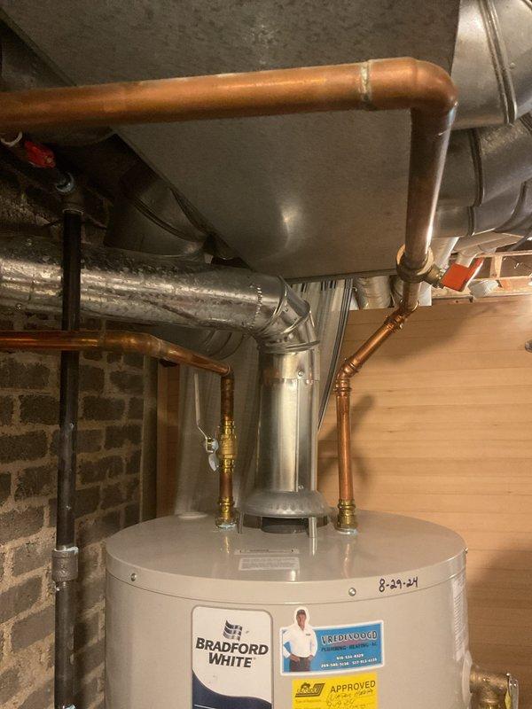 Responded to service call for inconsistent hot water delivery and air discharge from faucets. Inspected 2-year-old Bradford White automatic storage water heater model WT-8-2030. Diagnosed air trapped in distribution lines causing reduced hot water flow to multiple fixtures throughout the home. Purged air from system by bleeding lines at affected outlets. Verified proper water heater operation, checked inlet and outlet connections, and confirmed adequate water pressure and temperature settings. Tested hot water delivery at all fixtures to ensure consistent flow without air pockets. System restored to normal operation with full hot water distribution to all areas of the home.
