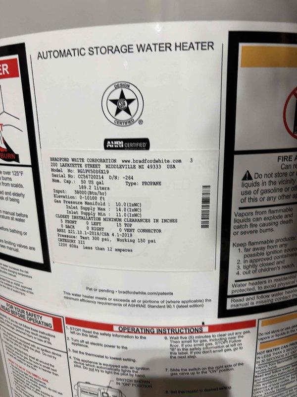 Successfully installed a Bradford White 50-gallon automatic storage water heater in basement utility area. Connected copper supply lines with brass fittings and valves to unit inlet and outlet connections, ensuring proper water flow and system integration. Verified all manufacturer specifications, safety labels, and operational parameters including 38,500 BTU input rating and propane fuel configuration for optimal performance.