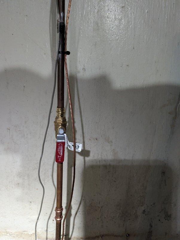 Completed QUOTR-quoted repair involving control board replacement in utility area. Assessed and photographed existing plumbing infrastructure showing aged copper piping with mineral deposits and corroded valve fixtures. Successfully replaced faulty control board, restoring system functionality within the estimated one-hour timeframe.