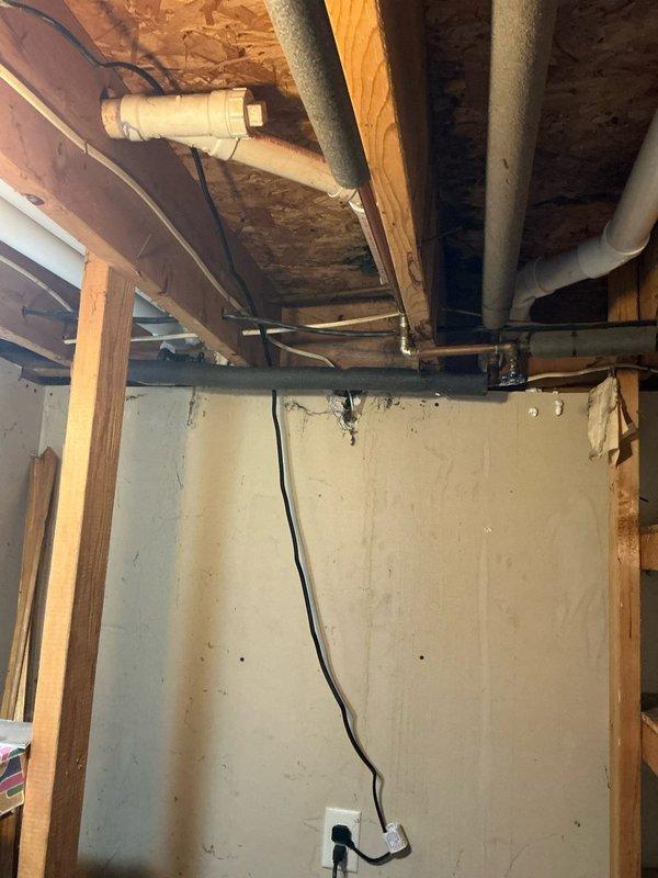 Conducted on-site evaluation for central air conditioning system installation in residential property as part of real estate transaction. Assessed existing forced-air furnace system in basement, documented current HVAC infrastructure including ductwork and electrical service, and photographed installation area to determine equipment requirements and labor scope for complete AC system addition to existing heating system.