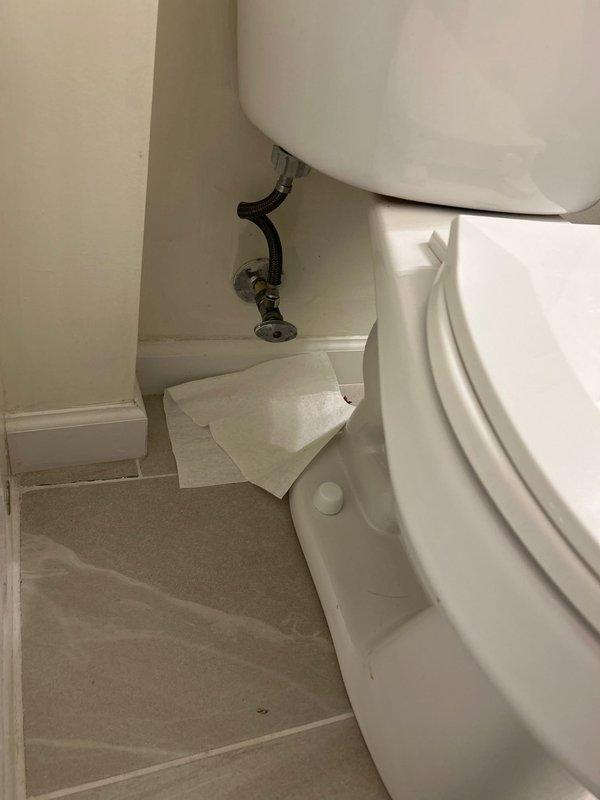 Responded to service call for toilet not flushing correctly. Upon inspection, removed tank lid and examined internal flush mechanism components including flush valve assembly and fill valve system. Documented existing conditions of toilet tank interior and surrounding bathroom area. Water supply line and wall valve connection verified as secure and functioning properly.