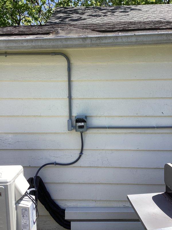 Installed dedicated electrical circuit and exterior conduit system for new mini-split HVAC unit, including junction box and proper weatherhead termination at roofline. Added GFCI-protected outlet and separate outlet for water heater, ensuring all installations meet current NEC code requirements with appropriate wire sizing and overcurrent protection.