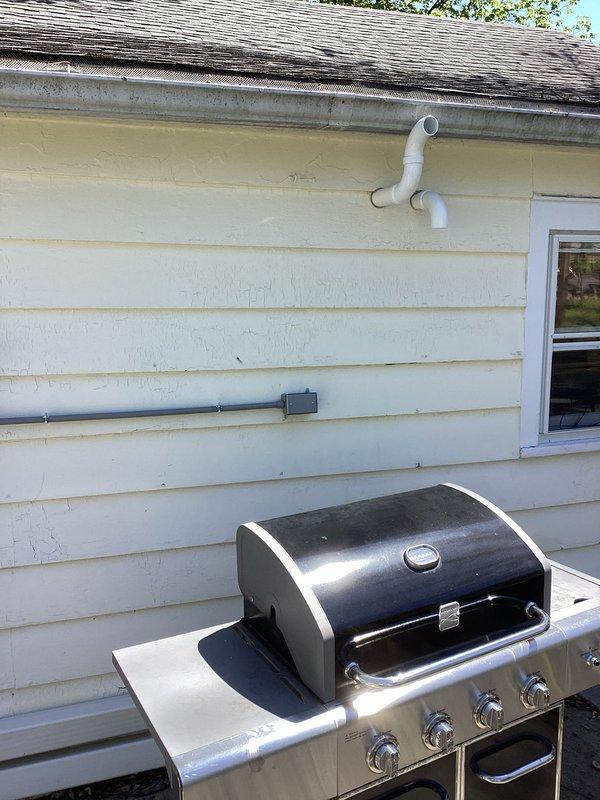 Installed dedicated electrical circuit and exterior conduit system for new mini-split HVAC unit, including junction box and proper weatherhead termination at roofline. Added GFCI-protected outlet and separate outlet for water heater, ensuring all installations meet current NEC code requirements with appropriate wire sizing and overcurrent protection.