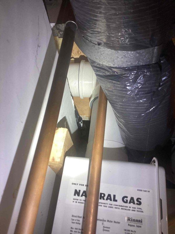 Completed estimate for tankless water heater replacement in attic installation. Assessed existing Rinnai natural gas tankless unit with associated copper gas supply lines, venting system with flexible metallic ductwork, and structural mounting configuration. Identified gas leak at valve requiring immediate replacement to ensure safe operation. Evaluated attic space accessibility, existing gas line routing, electrical connections, and venting requirements for proposed new tankless water heater installation. Provided comprehensive estimate covering tankless unit replacement, gas valve repair, and all necessary materials and labor to restore system to safe, code-compliant operation.