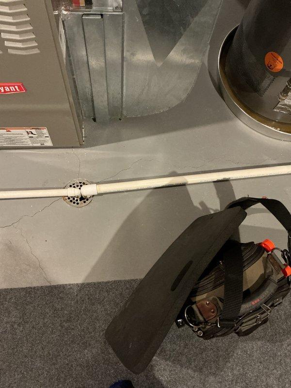 Responded to service call for leaking water heater. Upon arrival, inspected 8-year-old Rheem water heater in basement mechanical room and confirmed active leak. Documented equipment condition and installation with photographs for replacement quote preparation. Advised customer that water heater would likely require replacement due to age and nature of failure.