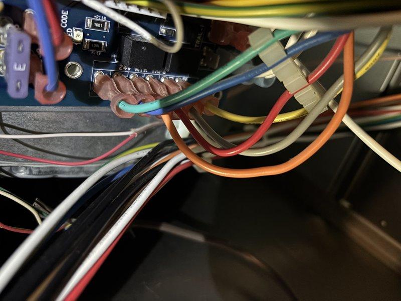 Completed complimentary annual cooling maintenance on Payne AC system as part of 5-year maintenance agreement. Performed system diagnostics including thermostat calibration verification using digital testing equipment, confirming proper temperature readings and control functionality. Inspected and documented electrical connections at control board, verifying all low-voltage wiring terminations, color-coded wire routing, and compression fittings for secure connections and proper system operation.