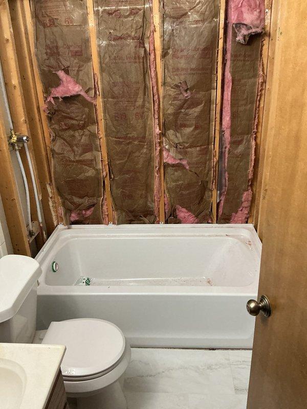 Completed installation of new Sterling tub/shower surround unit in residential bathroom. Installed customer-supplied shower valve and integrated plumbing connections to existing water supply lines. Project required 1.5 days to complete, with all fixtures properly set, sealed, and tested for functionality prior to completion.