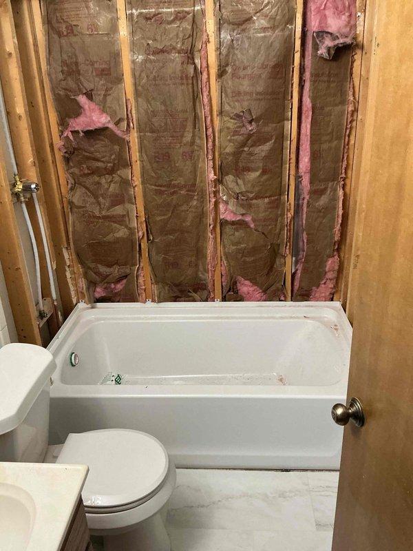 Completed installation of new Sterling tub/shower surround unit in residential bathroom. Installed customer-supplied shower valve and integrated plumbing connections to existing water supply lines. Project required 1.5 days to complete, with all fixtures properly set, sealed, and tested for functionality prior to completion.