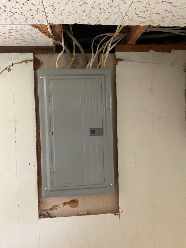 Completed electrical service upgrade under permit PE260062 with coordination through Grand Haven Power and Light for temporary disconnect and reconnect. Installed new electrical meter, emergency disconnect box, and upgraded interior electrical panel with proper conduit routing. Work included mounting exterior service equipment on building siding with PVC conduit connections, installing recessed interior panel box with ceiling wire entry, and completing all necessary rough-in work around panel installation. Scheduled and passed required electrical inspection, with power restoration completed same day following inspector approval.