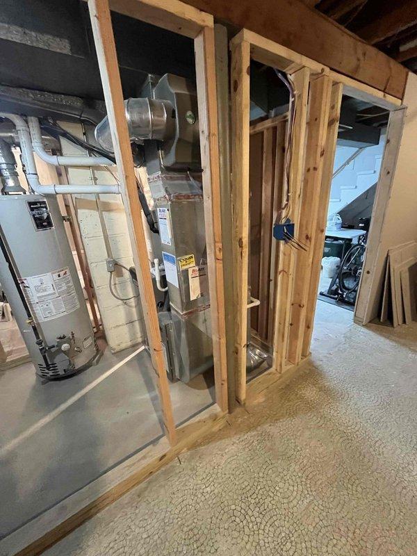 Completed comprehensive AC tune-up service on a Lennox air conditioning system located in basement utility area. Performed standard preventive maintenance procedures including system inspection, component testing, and performance verification to ensure optimal cooling efficiency for the upcoming season.