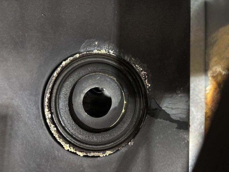 Completed QUOTR-quoted repair on HVAC collector box assembly. Addressed significant mineral deposit buildup around bearing/bushing component at the central opening, which was restricting proper operation. Cleaned and serviced the affected circular mechanical component where white crusty residue had accumulated along the perimeter and housing interface. Inspected burner box compartment, gas valve assembly, and associated electrical connections. Verified all mounting hardware secure on heat exchanger cover. Documented pre-existing surface oxidation on brass fittings and minor rust staining on burner box panel. System restored to proper working order with all components functioning as designed.