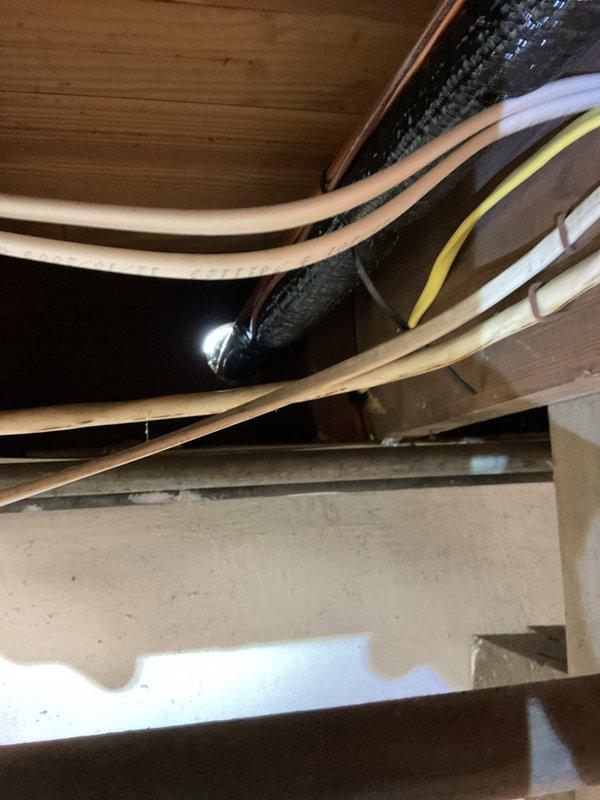 Completed annual cooling system maintenance and inspection. Verified proper operation of condensate drainage system in attic space, including drain pan, discharge lines, and associated plumbing connections. Inspected HVAC equipment installation, confirmed proper routing of refrigerant lines, electrical connections, and ductwork components. System operating within normal parameters.