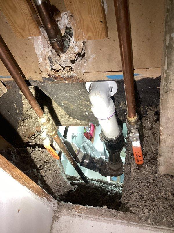Responded to slow-draining bathtub caused by significant buildup in small-diameter piping with multiple sharp turns that prevented conventional snake access. Accessed drain lines through basement crawl space, identifying corroded metal piping and restricted flow points. Cleared blockage using specialized equipment suitable for tight configurations, inspected P-trap assembly and connecting pipes, and verified proper drainage flow restoration upon completion.