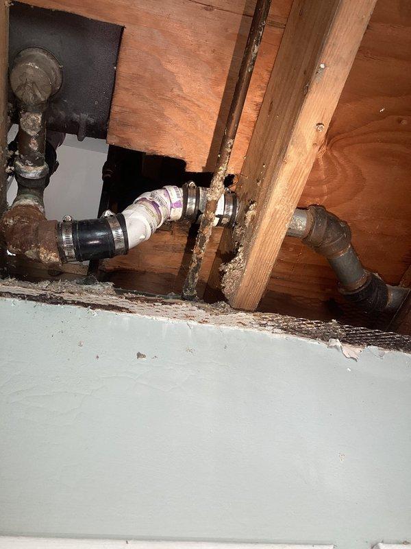Responded to slow-draining bathtub caused by significant buildup in small-diameter piping with multiple sharp turns that prevented conventional snake access. Accessed drain lines through basement crawl space, identifying corroded metal piping and restricted flow points. Cleared blockage using specialized equipment suitable for tight configurations, inspected P-trap assembly and connecting pipes, and verified proper drainage flow restoration upon completion.