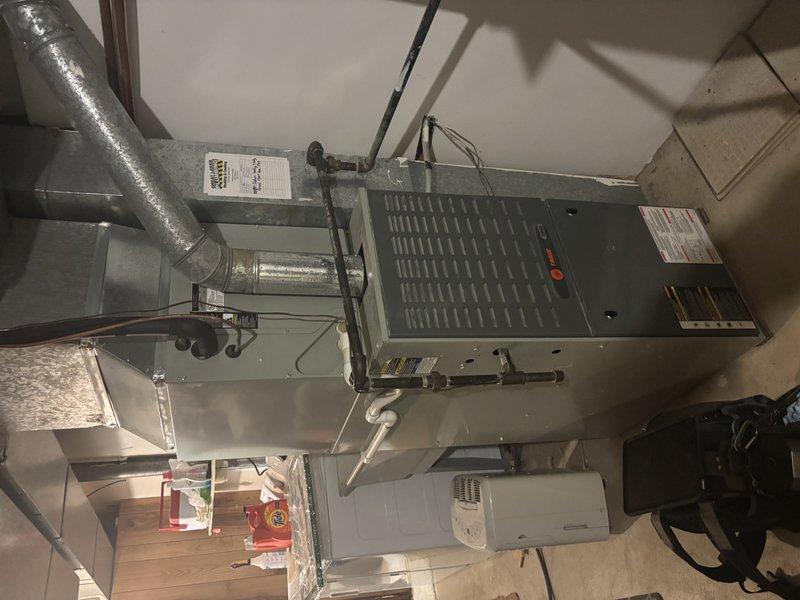 Completed comprehensive ASTU-AC Super Tune-up service on a 16-year-old air conditioning system in a residential basement installation. Performed full system inspection of the HVAC air handler unit, verified all electrical connections and safety controls including disconnect switch operation, inspected and documented ductwork configuration including flexible insulated ducting, checked refrigerant lines, and confirmed proper system operation. All components found to be functioning within normal parameters for the unit's age.