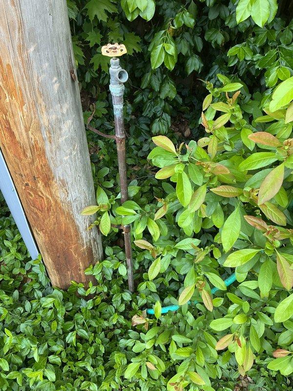 Responded to quoted repair for faulty vacuum breaker replacement on exterior spigot. Upon arrival, located primary hose bib surrounded by overgrown vegetation and confirmed vacuum breaker failure. Successfully replaced defective vacuum breaker assembly and verified proper operation. Additionally inspected secondary outdoor spigot that had sustained freeze damage as requested. Assessed piping configuration at gas meter wall location and identified compromised pipe section requiring replacement due to winter freeze conditions. Completed necessary pipe repair to restore full functionality to both exterior water fixtures. All work tested and confirmed operational upon completion.