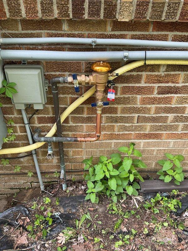 Responded to quoted repair for faulty vacuum breaker replacement on exterior spigot. Upon arrival, located primary hose bib surrounded by overgrown vegetation and confirmed vacuum breaker failure. Successfully replaced defective vacuum breaker assembly and verified proper operation. Additionally inspected secondary outdoor spigot that had sustained freeze damage as requested. Assessed piping configuration at gas meter wall location and identified compromised pipe section requiring replacement due to winter freeze conditions. Completed necessary pipe repair to restore full functionality to both exterior water fixtures. All work tested and confirmed operational upon completion.