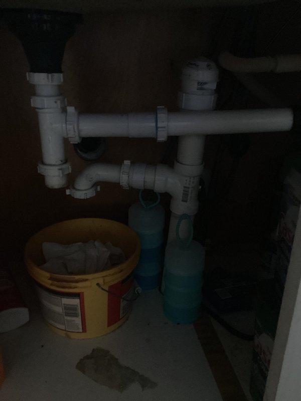 Responded to plumbing leak caused by failed coupling from previous repair. Upon inspection, identified cracked PVC coupling in under-sink drainage system. Replaced defective coupling with new fitting, tested P-trap assembly for proper drainage and verified no additional leaks present. System restored to full working condition.