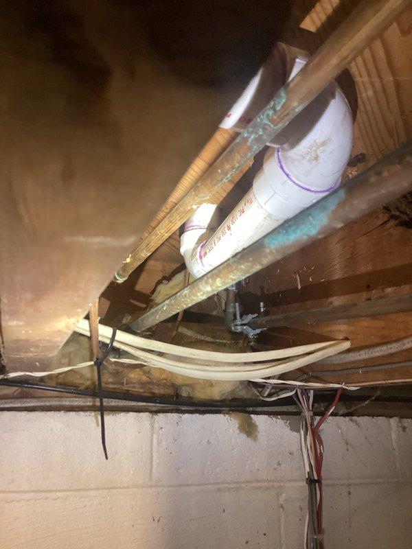 Responded to plumbing leak caused by failed coupling from previous repair. Upon inspection, identified cracked PVC coupling in under-sink drainage system. Replaced defective coupling with new fitting, tested P-trap assembly for proper drainage and verified no additional leaks present. System restored to full working condition.