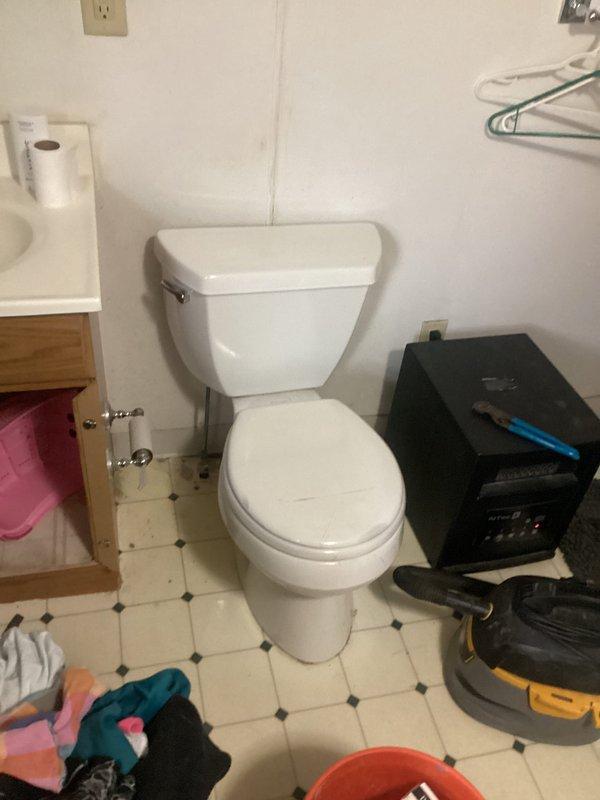 Responded to customer report of water leaking from the base of the toilet onto the floor after flushing. Upon arrival, removed toilet from floor flange to inspect the seal and mounting hardware. Found heavily corroded and rusted toilet flange with deteriorated wax ring seal, which was the source of the leak. The flange exhibited significant oxidation and the surrounding floor area showed evidence of water damage and staining from prolonged moisture exposure. Removed old wax ring and cleaned the flange area of debris and residue. Replaced the defective wax ring with new seal and reinstalled toilet, ensuring proper alignment with flange and secure mounting to prevent future leaks.