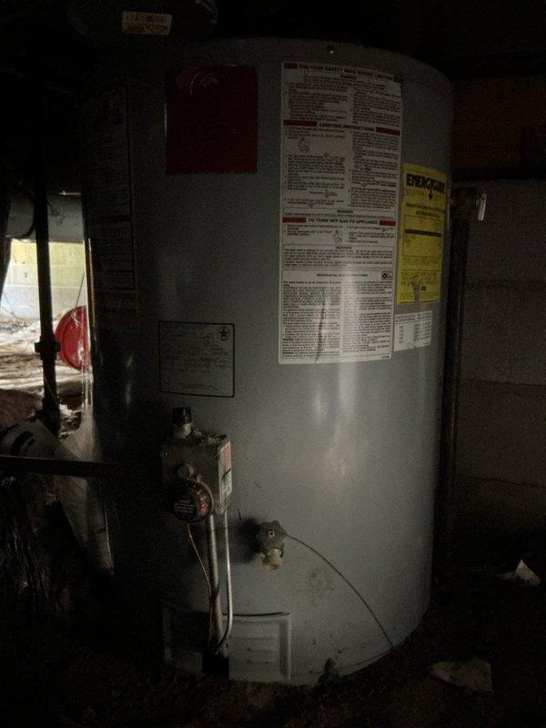 Accessed crawl space to assess existing water heater installation and provided estimate for replacement with low boy model due to space constraints. Documented current gas-fired water heater unit with standard residential specifications, including all piping connections, gas control valve assembly, and venting configuration. Recommended appropriate low-profile replacement unit to accommodate limited vertical clearance in crawl space area.