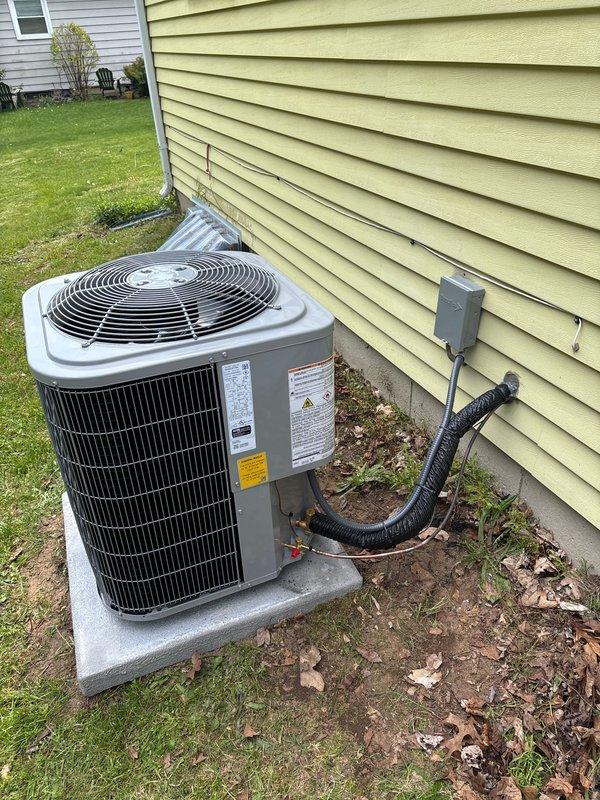 Completed full system replacement including installation of new Carrier furnace, air conditioning unit, and water heater. The furnace and water heater were installed in the basement utility area with proper venting, electrical connections, and PVC condensate drainage. The outdoor AC condenser unit was positioned on a concrete pad adjacent to the home's exterior with appropriate electrical disconnect, refrigerant line connections, and protective conduit routing to ensure code-compliant operation of the complete HVAC system.