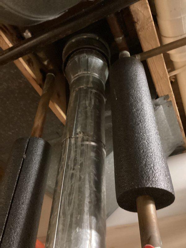 Completed annual cooling maintenance on 16-year-old Goodman air conditioning system. Performed comprehensive tune-up including inspection of refrigerant lines, condensate drain system, and associated plumbing connections. Verified proper operation of all mechanical components and documented equipment condition with photographic records showing pipe insulation integrity and condensate management system functioning correctly.