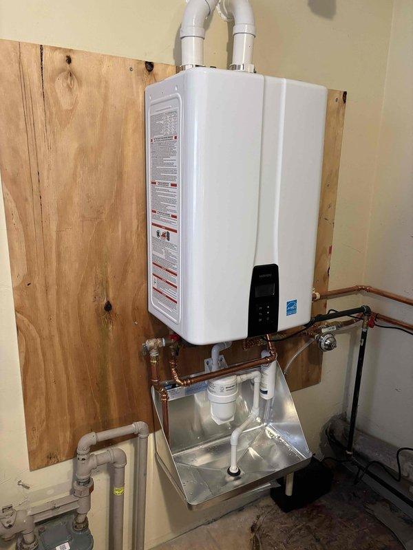 Responded to a no water pressure complaint on a Navien tankless water heater. Upon inspection, identified and resolved flow restriction issues affecting the unit's operation. Verified proper water pressure restoration, tested all connections for leaks, and confirmed the tankless water heater returned to normal operating parameters with adequate flow throughout the system.