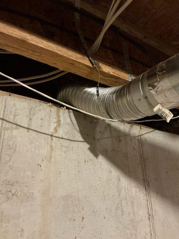 Conducted evening sales estimate for complete furnace and air conditioning system replacement in residential property. Assessed existing HVAC infrastructure in unfinished basement area, including current ductwork configuration with large sheet metal trunk lines and flexible branch ducts supported by metal hangers throughout exposed ceiling joists. Documented existing mechanical systems, storage layout, and structural conditions to determine optimal equipment placement and installation requirements for proposed heating and cooling system upgrade.