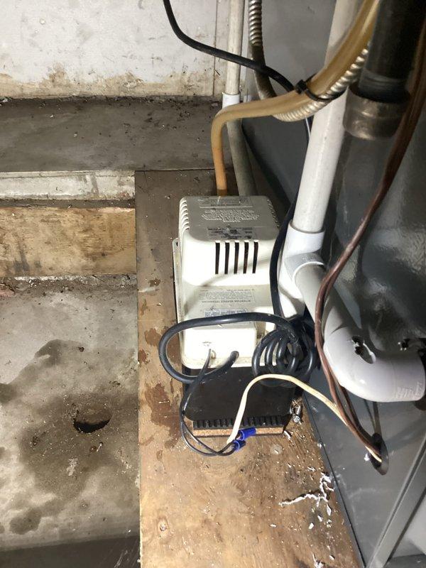 Completed annual cooling maintenance on a 2011 EnergiAir system, including inspection of the outdoor condensing unit and indoor condensate pump assembly. Verified proper operation of all components, checked refrigerant levels, cleaned condenser coils, inspected electrical connections, and confirmed condensate drainage system is functioning correctly with no visible leaks or blockages.