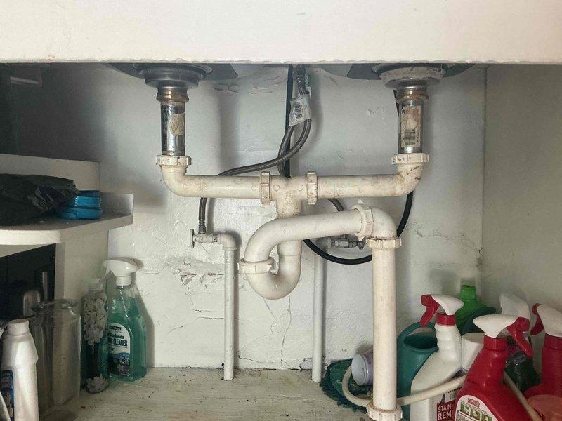 Responded to plumbing leak emergency involving two separate issues. Addressed cracked pipe under kitchen sink that had begun leaking that afternoon. Upon inspection, found deteriorated section of supply line within cabinet requiring immediate replacement. Shut off water supply to affected area, removed damaged pipe section, and installed new piping with proper fittings to restore functionality. Verified P-trap assembly and drain connections remained secure with no additional leaks present.

Additionally addressed burst pipe at outdoor spout that had occurred during winter freeze conditions. Inspected exterior plumbing where freeze damage had compromised pipe integrity. Replaced damaged section of outdoor supply line and installed new frost-proof spigot assembly to prevent future freeze-related failures. Both repairs were isolated to their specific locations with no indication of systemic plumbing issues throughout the property. Tested all repaired connections under full water pressure 