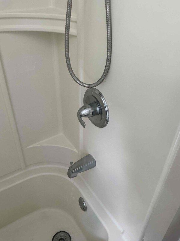 Replaced defective DELTA RP19804 cartridge in Series 1300/1400 tub and shower valve. Accessed valve assembly through wall opening, removed old cartridge, and installed new replacement unit. Tested shower control operation and verified proper temperature regulation and flow control upon completion.