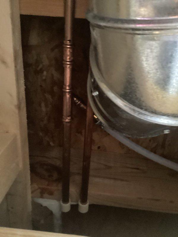 Replaced refrigerator water supply line with new copper piping running through attic utility space to kitchen area. Secured line with proper mounting brackets and tested system for proper water flow and leak-free connections upon completion.