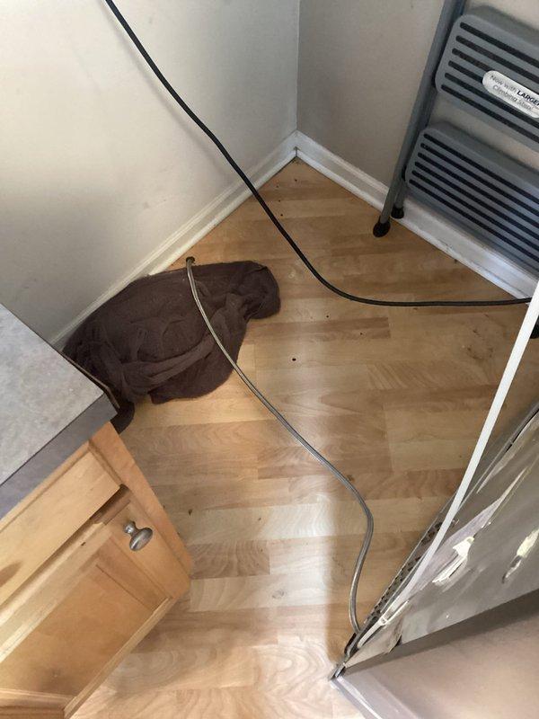 Replaced refrigerator water supply line with new copper piping running through attic utility space to kitchen area. Secured line with proper mounting brackets and tested system for proper water flow and leak-free connections upon completion.