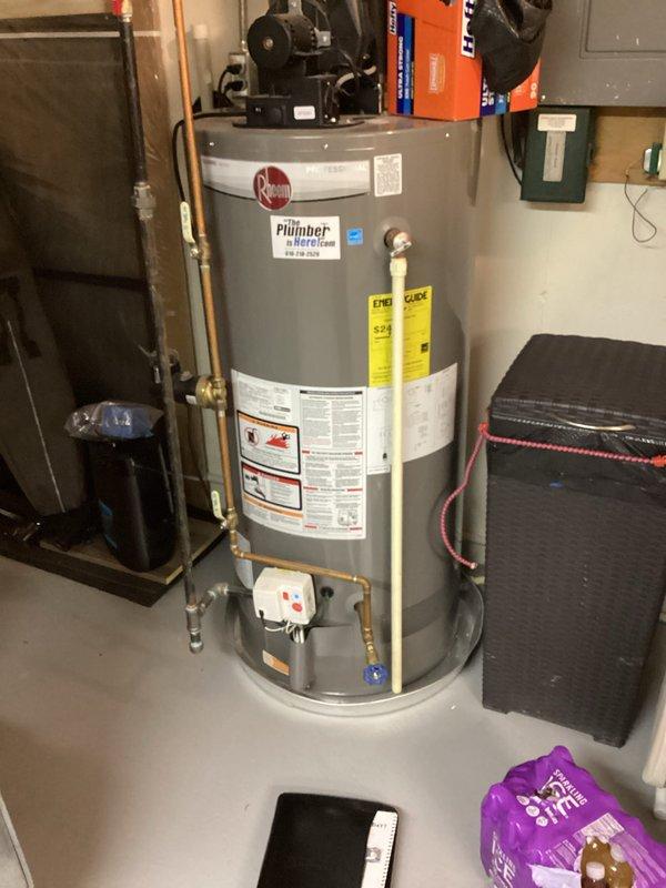 Conducted on-site assessment of 10-year-old Rheem water heater for replacement estimate in residential basement utility room. Documented existing equipment configuration including copper supply piping connections, electrical panel proximity, and clearance requirements around unit. Photographed current installation specifications, manufacturer labels, safety warnings, and surrounding HVAC equipment layout to provide accurate replacement quote for customer-requested water heater upgrade.