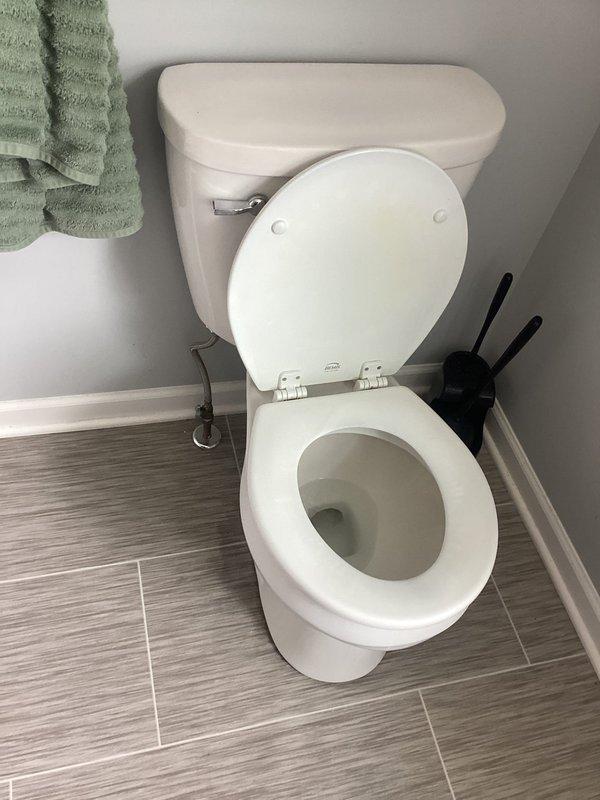 Pulled and reset toilet to address underlying issue. Removed toilet from floor flange, inspected wax ring and flange condition, and reinstalled unit with new wax seal. Reconnected water supply line, tested for proper flush operation and verified no leaks at base or supply connection. Toilet restored to full working order.