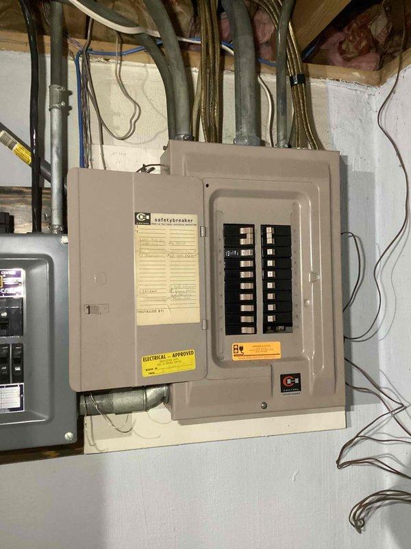 Completed furnace and air conditioning system estimate for in-law suite property in preparation for upcoming ownership transfer. Evaluated existing HVAC infrastructure, electrical service capacity at exterior meter location, and main electrical panel configuration in basement utility area to determine equipment compatibility and installation requirements for new heating and cooling system.