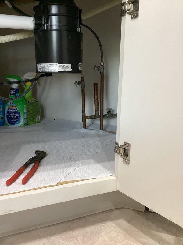 Installed water shut-off valves under kitchen sink to provide proper isolation capability for the plumbing fixtures. Successfully completed dishwasher installation, connecting all necessary water supply and drain lines to the existing disposal system, ensuring proper operation of the appliance.
