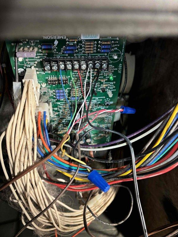 Responded to no heating or cooling complaint on newly installed EnergiAir WT 4-2036 system with thermostat displaying "no power to RC wire" error. Upon inspection, found Emerson control board with improper wiring connections at terminal strip. Corrected RC wire connection to provide proper 24V power supply to thermostat, verified all low-voltage wiring terminations at control board, and confirmed proper communication between thermostat and HVAC system. Tested system operation in both heating and cooling modes to ensure full functionality restored.
