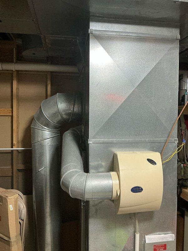Conducted on-site evaluation for furnace and air conditioning system replacement. Both units are 16 years old and nearing end of service life. Assessed existing HVAC infrastructure including ductwork, humidifier integration, and refrigerant line routing in basement mechanical space. Documented current system configuration featuring air handler with attached humidification equipment and identified replacement requirements for aging heating and cooling equipment. Provided comprehensive replacement estimates for furnace-only option and combined furnace/AC system upgrade.