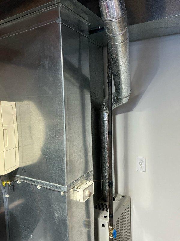 Conducted on-site assessment for furnace replacement estimate at residential property. Evaluated existing HVAC system including outdoor AC condenser unit and indoor furnace with ductwork installation in utility space. Documented current equipment configuration, electrical disconnect components, and duct routing to provide comprehensive replacement proposal.