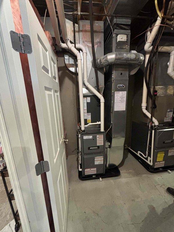 Completed full furnace installation in basement mechanical room. Installed new high-efficiency furnace unit with proper venting configuration using PVC intake and exhaust piping. Positioned equipment on condensate drain pan for moisture management. Connected all necessary ductwork to existing HVAC distribution system. Routed and secured all venting pipes according to manufacturer specifications and code requirements. Verified proper clearances from combustible materials and insulated walls. Completed all electrical connections and tested system operation to ensure proper functionality.