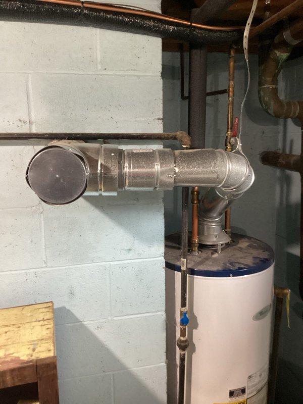 Conducted on-site evaluation of existing water heater installation in basement utility area and provided comprehensive estimate for replacement. Documented current system configuration including water heater unit, copper supply lines, galvanized venting components, shut-off valves, and electrical connections to determine replacement specifications and scope of work required.